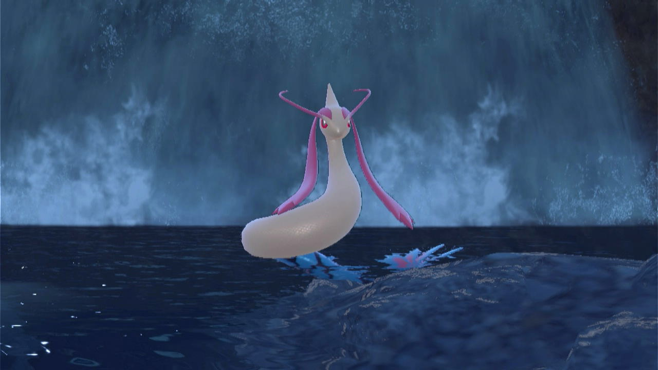 A Milotic standing in front of a waterfall in Pokémon Scarlet and Violet The Teal Mask