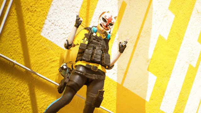 Contestant in front of yellow wall in The Finals.