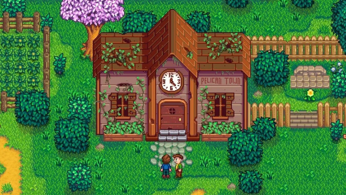 Stardew Valley: the player stood in front of the community center with mayor Lewis.