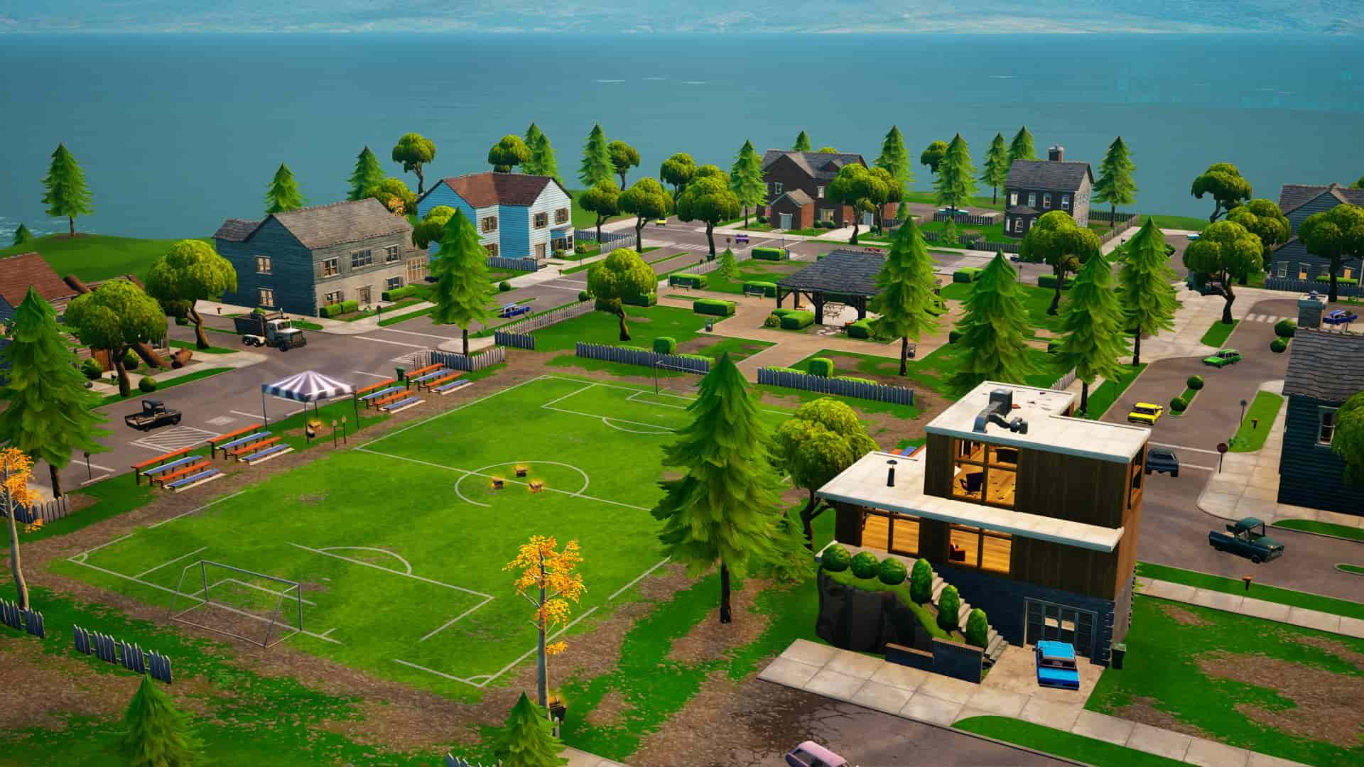 A soccer pitch surrounded by houses on all sides