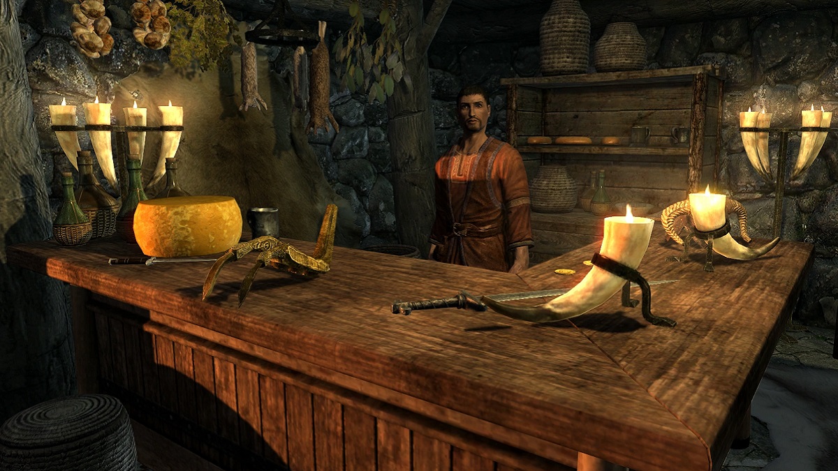 Skyrim: Riverwood's Lucan Valerius stands behind his counter that has a large, golden claw on it.