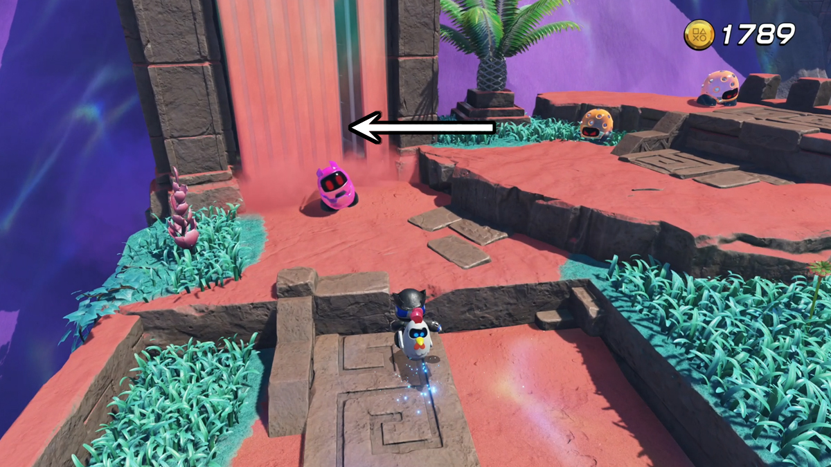 Astro Bot approaching an enemy with an arrow pointing to a captive bot.