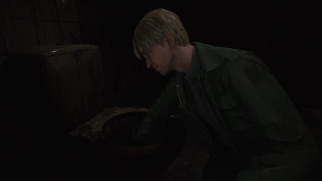 Silent Hill 2 Remake James reaches his hands into a disgusting toilet.