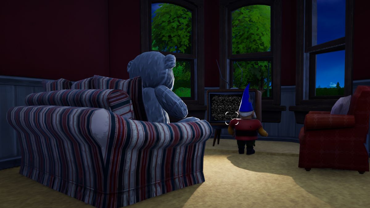 A teddy bear and gnome watch TV and there's nothing ominous about it