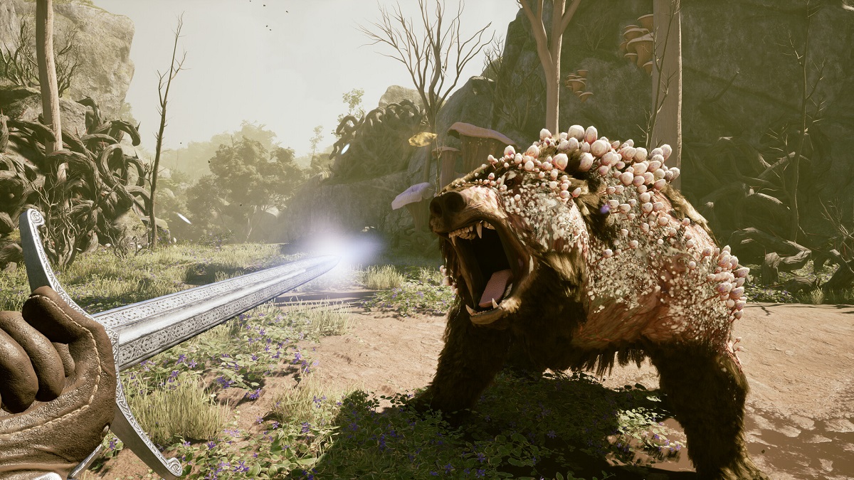 Avowed: a first-person perspective of a sword about to strike at an attacking bear that's covered in fungi.