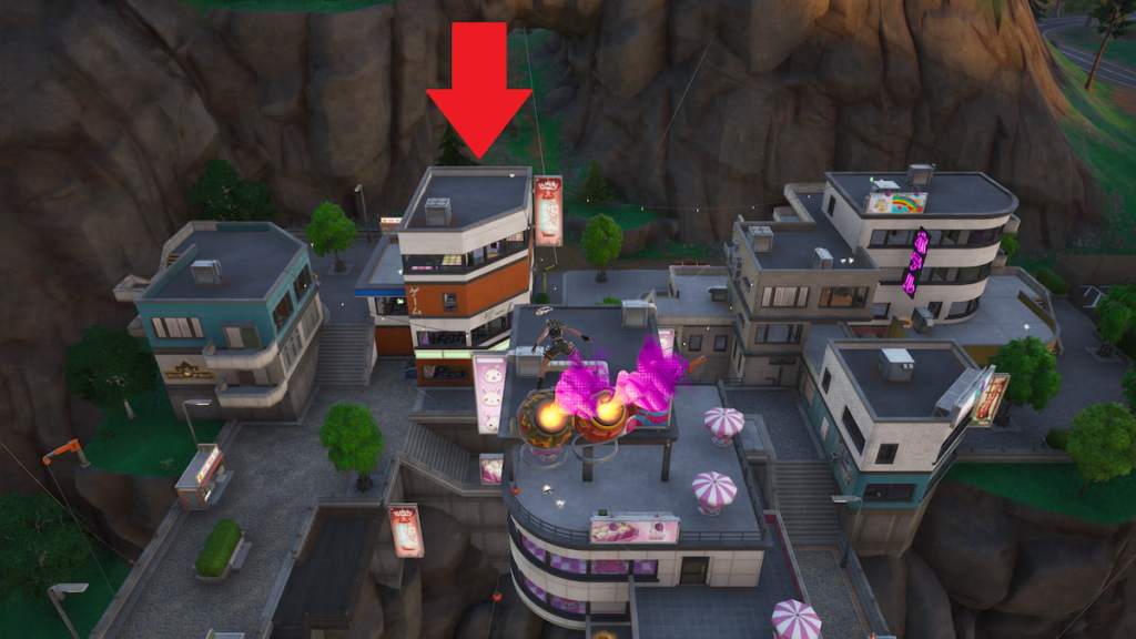 A tall orange and white building that has the Sabrina Carpenter Easter egg marked with a red arrow in Fortnite.
