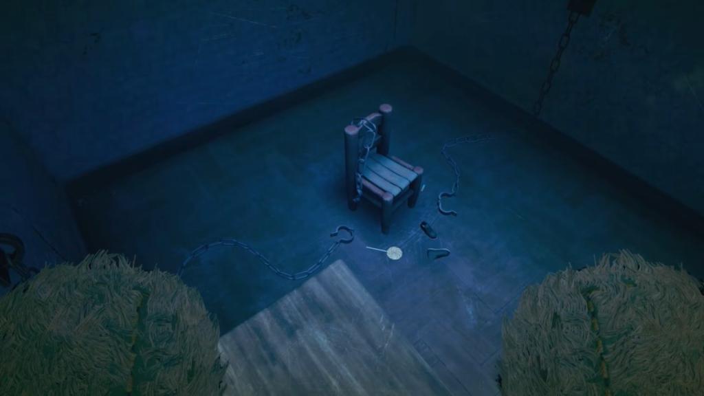 A single chair in an empty room with shackles and candy on the floor beside it