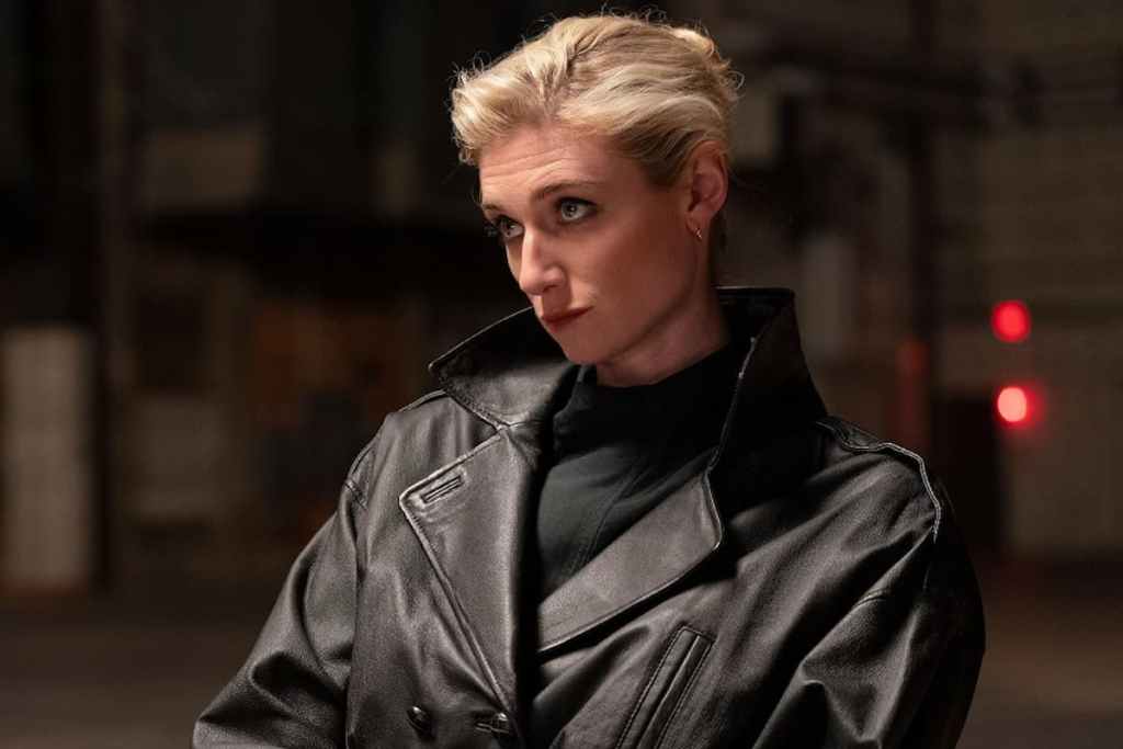 Elizabeth Debicki acting and dressed in a leather jacket.