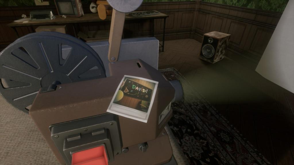 Polaroid of DAVID name written on blackboard in green, magenta, blue, red, and yellow