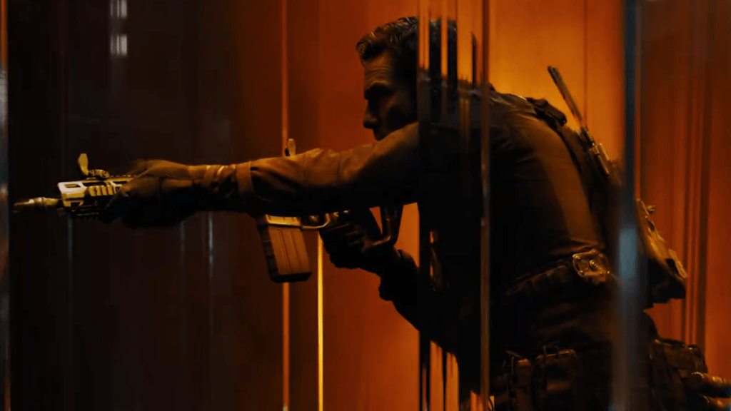 A man holding a gun and pointing it to the side in the trailer for Call of Duty Black Ops 7. 