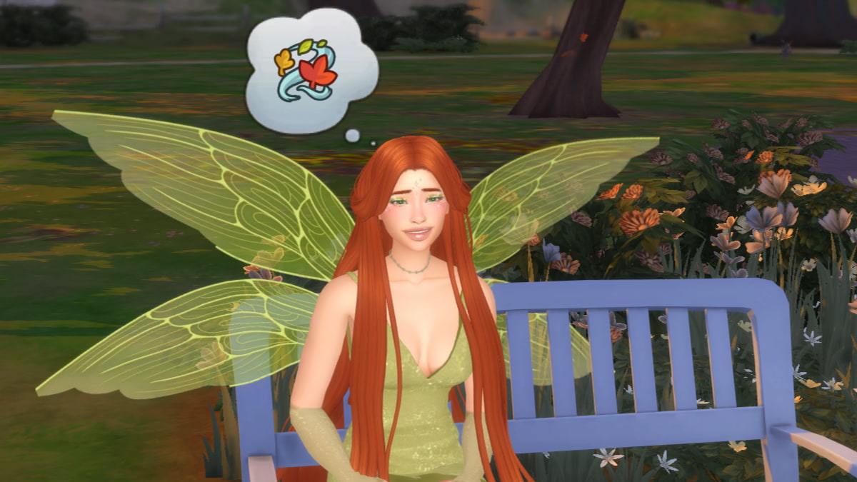 A Sim dressed as a fairy in a green dress with green wings and long orange hair sitting on a bench and listening to the wind in The Sims 4