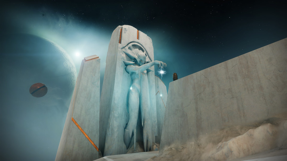 A statue of the Conductor carved out of the rock of the Desert Perpetual raid in Destiny 2. She holds her hand out as if pulling a puppet's strings, and a Vex cube appears below it.