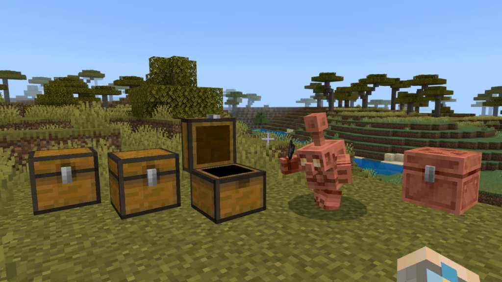 A Copper Golem sorting items in chests in Minecraft