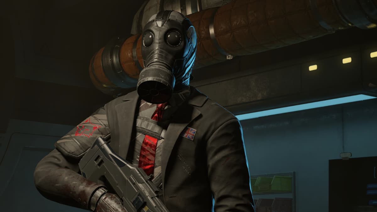 A man in a gas mask standing in a computer room in Killing Floor 3.
