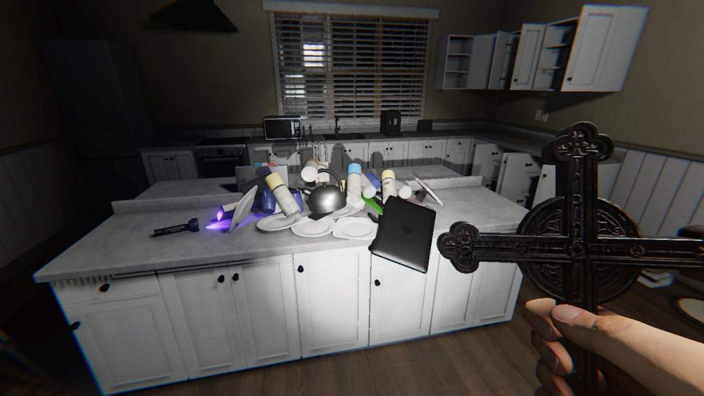 A bunch of small items piled on a counter in phasmophobia