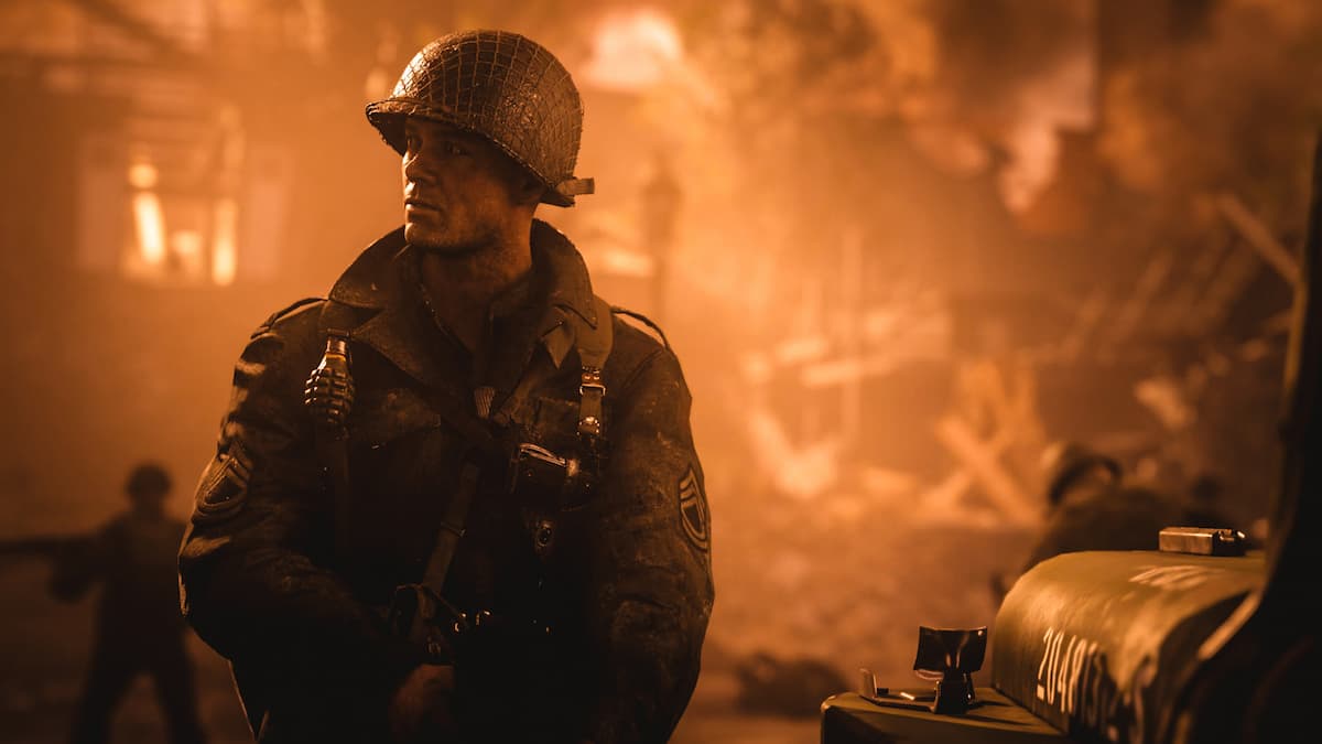 A US army Marine standing in a flaming city in COD WW2.