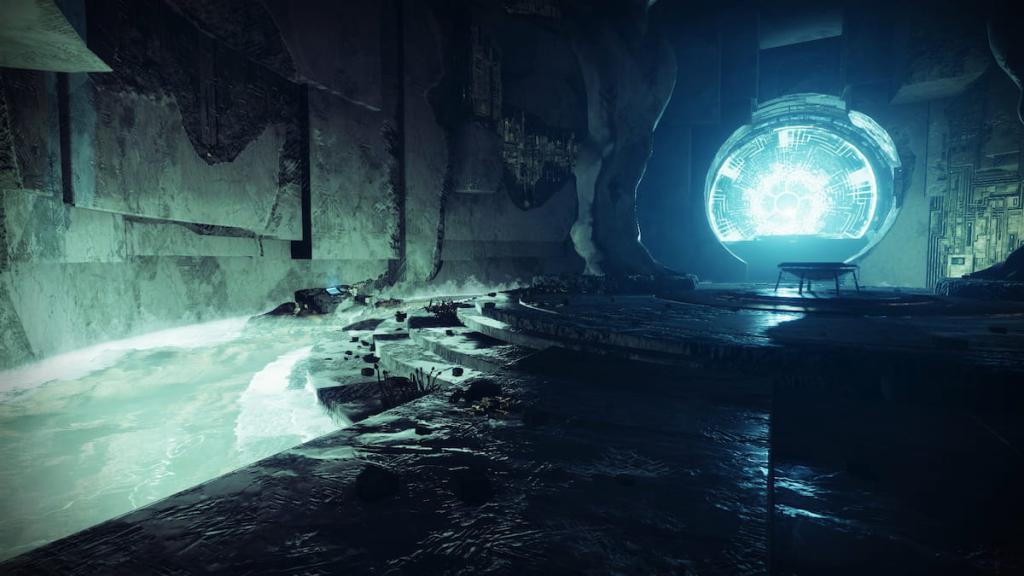 A data pad glows on a rock on the left side of the image, which shows a room with a Vex portal and some statues carved in rock.