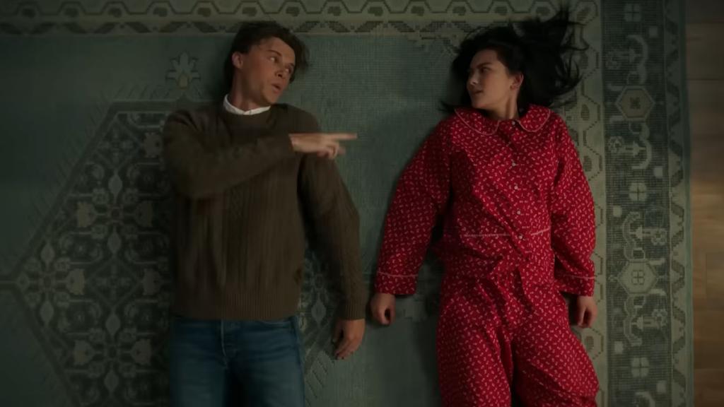 Conrad pointing at Belly lying on the ground in the summer i turned pretty