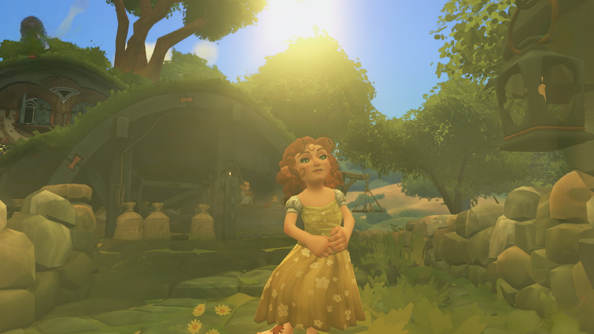 A hobbit in a yellow dress standing in front of the mill in tales of the shire