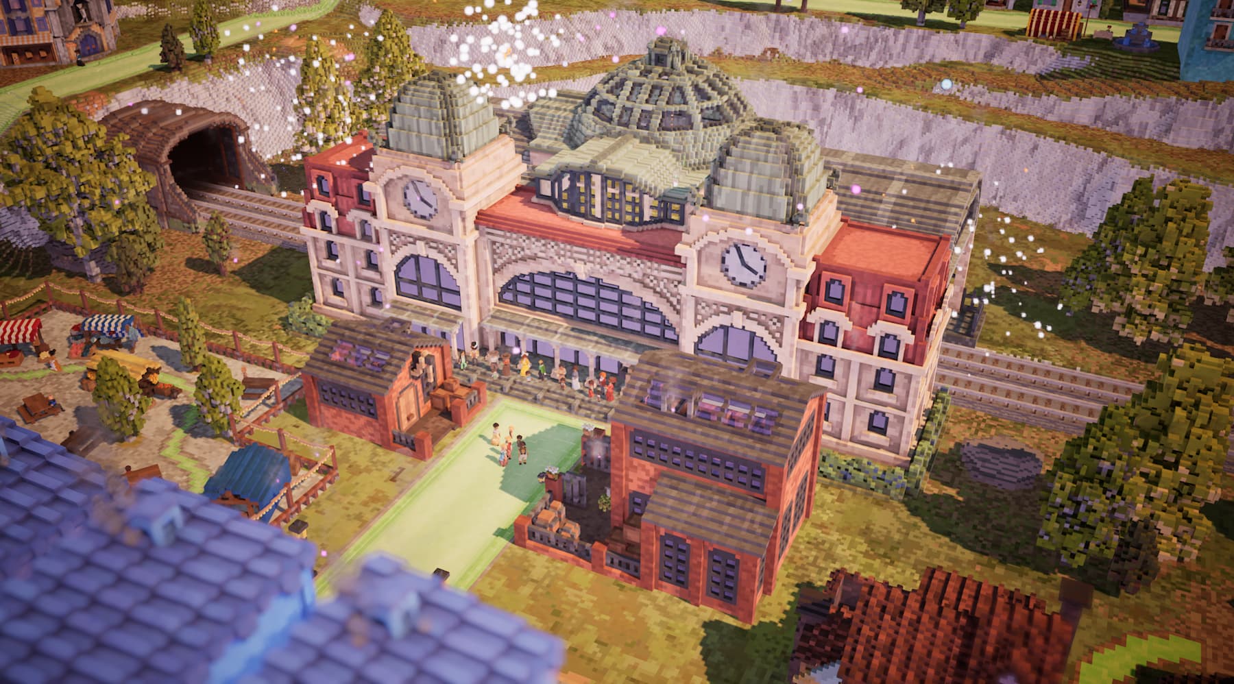 A screenshot from Town to City showing a train station in blocky, pixelated art.