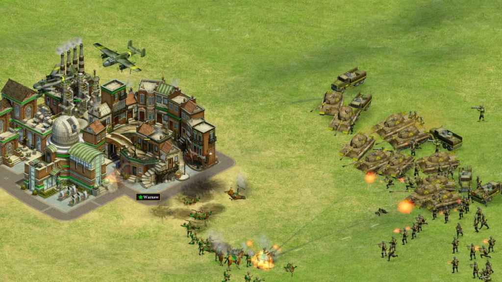 Tanks and infantry attacking a town in Rise of Nations.