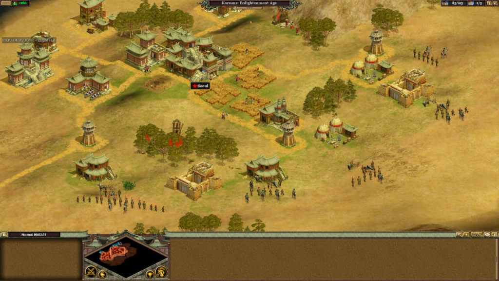 Various buildings, units, and fields of wheat in Rise of Nations.