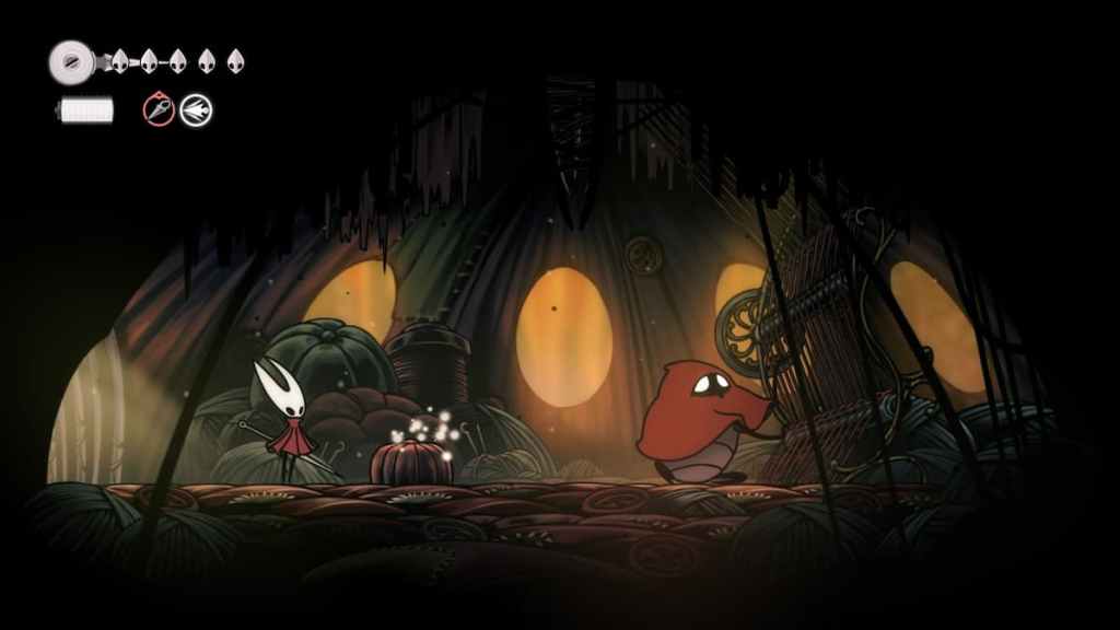 Hornet and the Seamstress standing in a massive tent, with the seamstress working threads in Hollow Knight Silksong. 