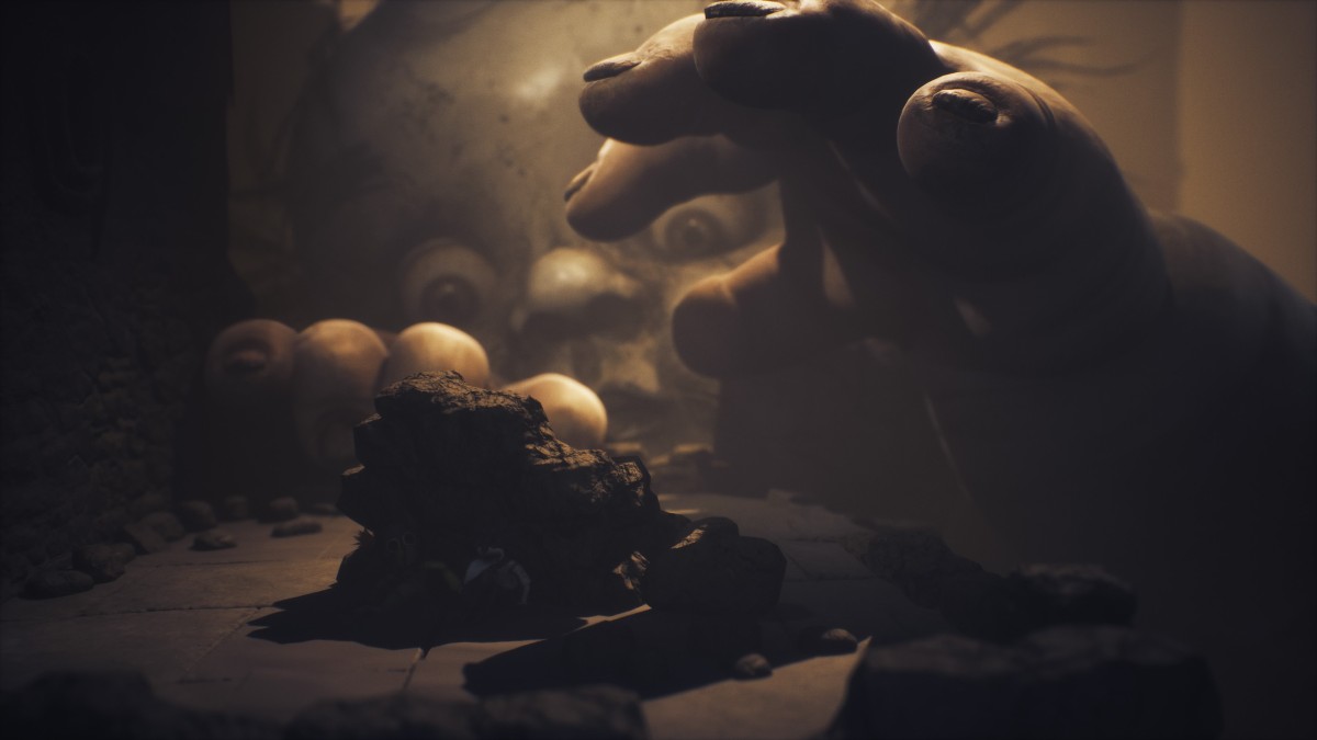 The Monster Baby peeking over, using its hands to search for Low and Alone