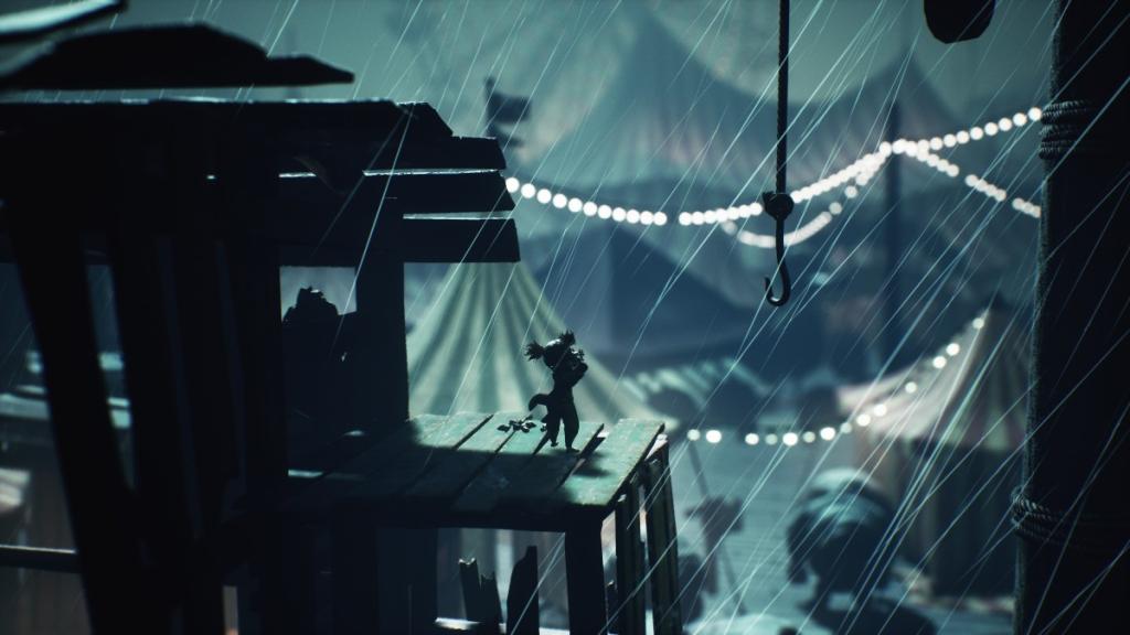 Picking up the doll as lightning strikes with Guests pictured below, enjoying the carnevale