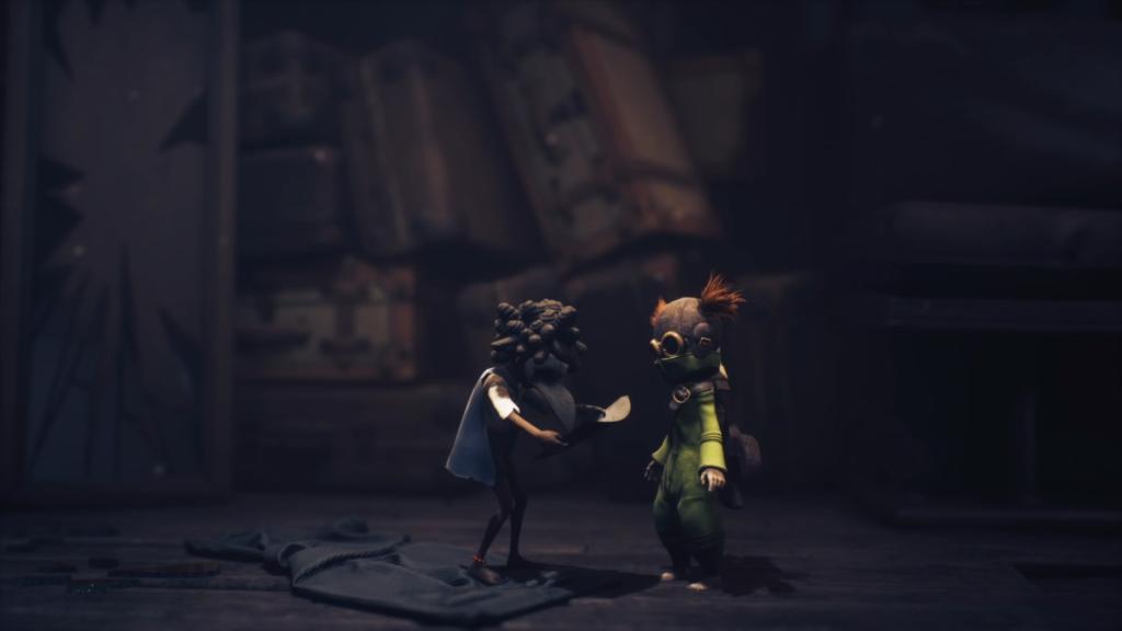 Low and Alone looking at the map at the start of Little Nightmares III