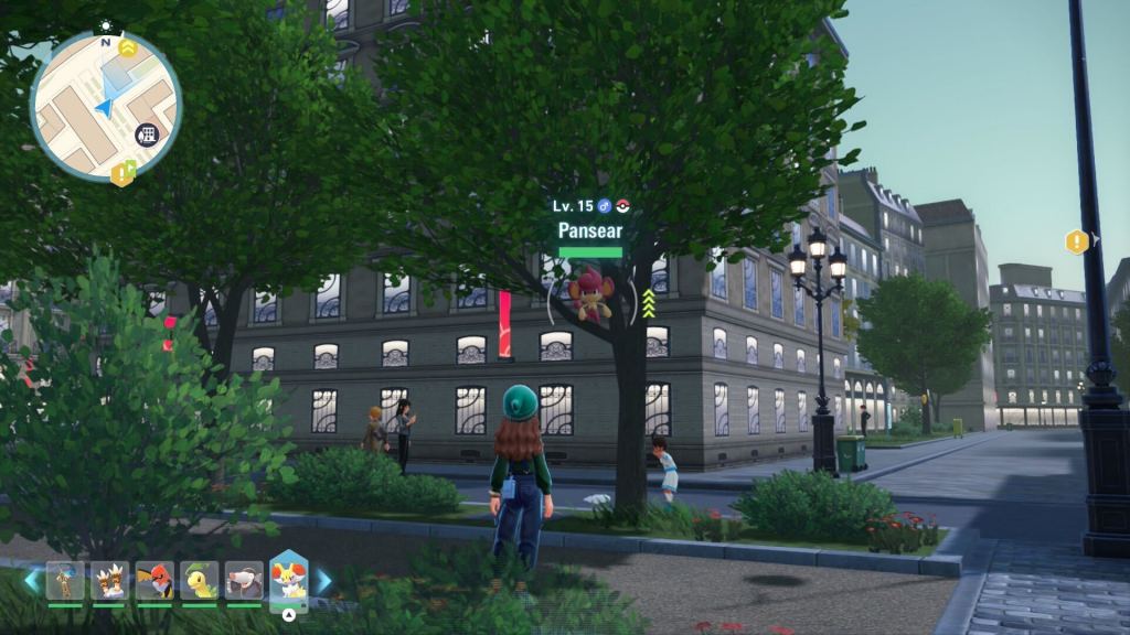 A screenshot from Pokemon Legends ZA showing a Pansear, a Fire Monkey, in a tree. 