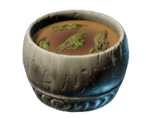 Herbal Mountain Tea in Enshrouded, showing a wooden cup with green leaves in the tea.