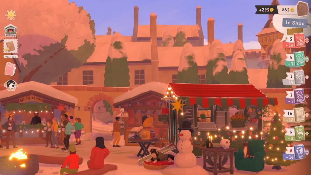 A small, festive red and green bookshop set up at a holiday market in tiny bookshop