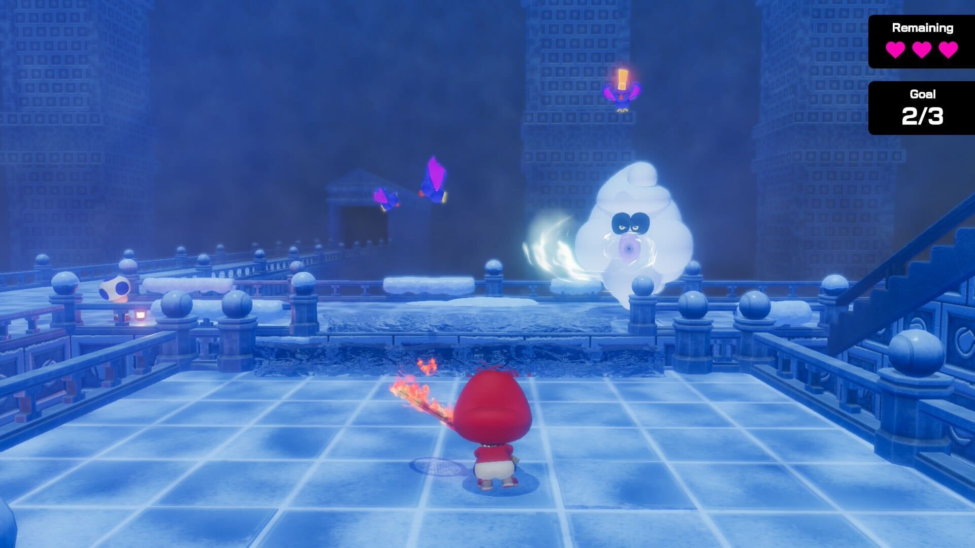 Baby Mario stands in an ice palace with a tornado monster blowing wind at him.