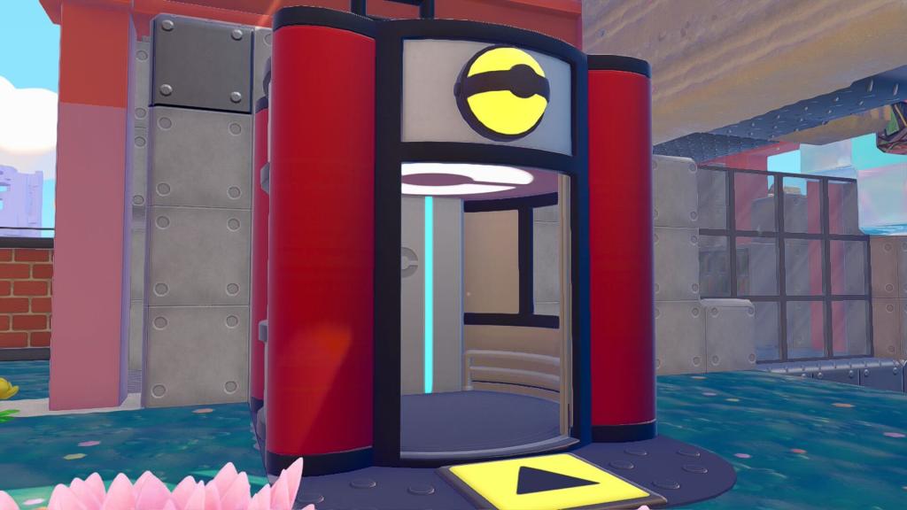A red elevator in Pokopia with a yellow Pokeball light at the top and an arrow pointing towards the elevator's entrance.