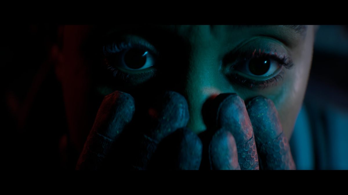 Close up of Young's face with her hands encroaching towards her eyes
