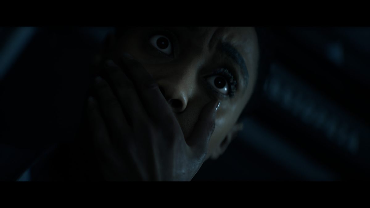 Young covering her mouth and holding her breath