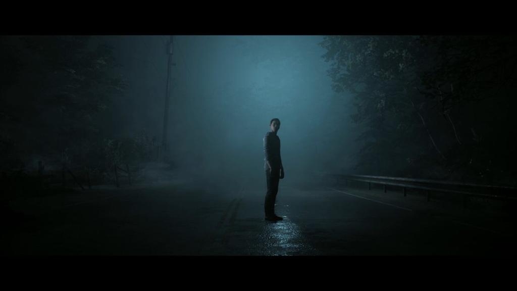 Andrew standing in middle of misty road